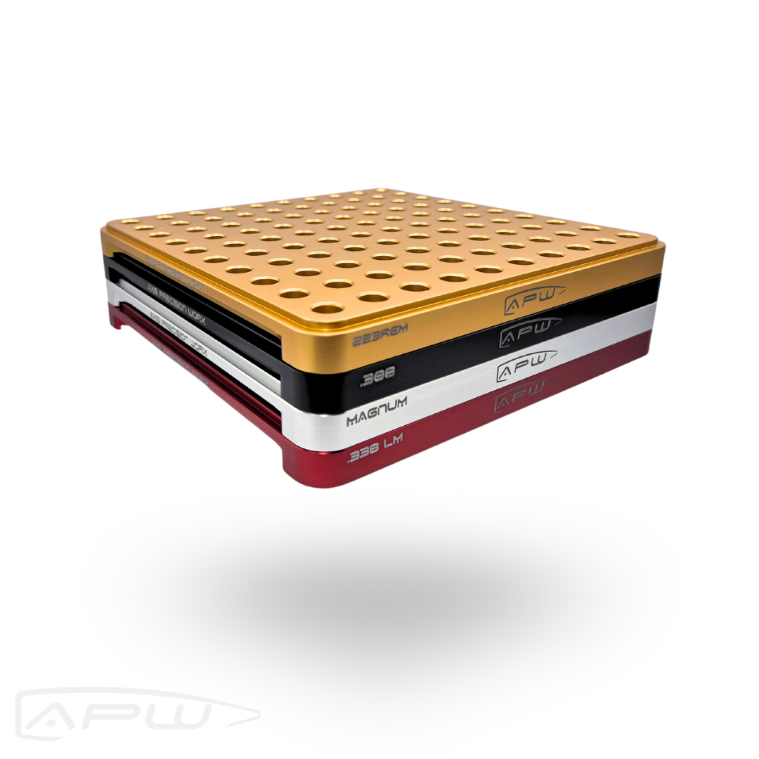 Four color-coded APW stackable 100-slot reloading blocks stacked together