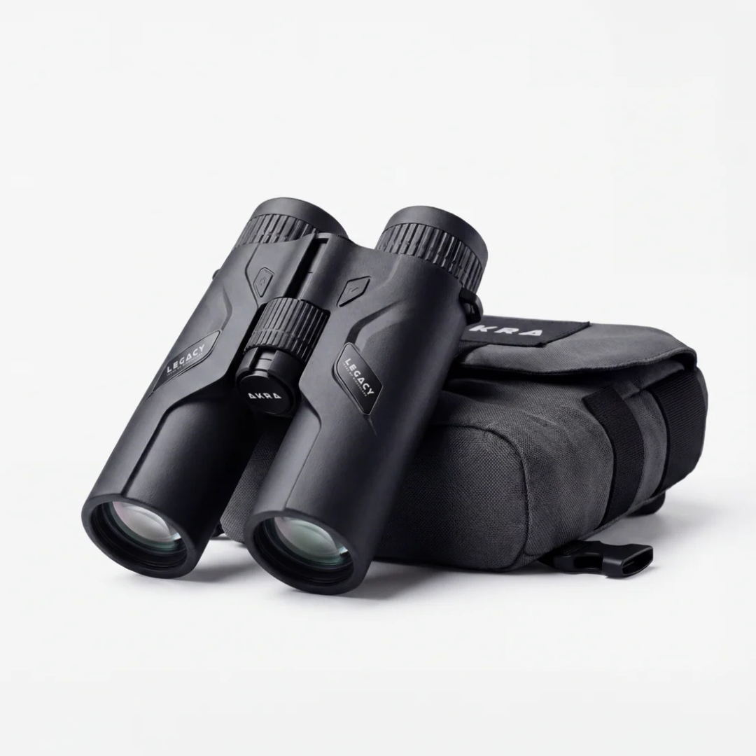 AKRA Legacy 10x42 rangefinding binoculars displayed next to the durable tactical chest pack.