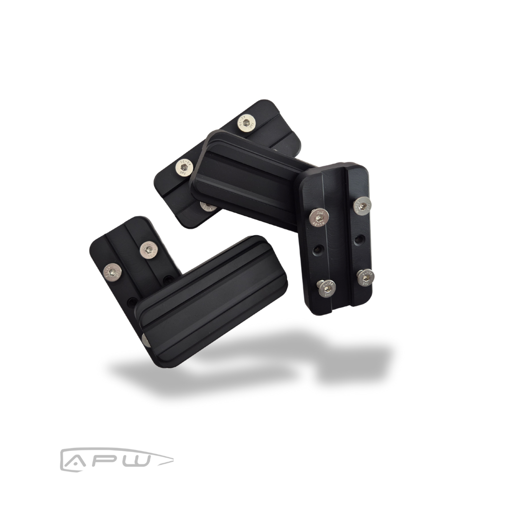 Five black steel internal forend weights for MDT ACC chassis displaying clearance slots and mounting screws on a white background